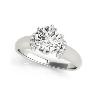 A platinum ring with a round diamond