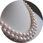 double-stranded pearl necklace on a white background